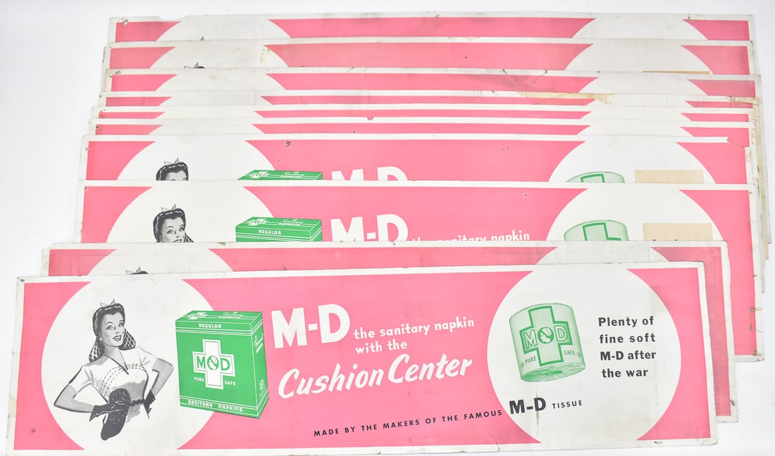 TEN M-D SANITARY NAPKINS TROLLEY ADVERTISEMENT SIGNS, WWII ERA: Ten trolley advertisement signs for M-D sanitary napkins made circa 1950's. All ten signs measure 11" H x 42" W.
