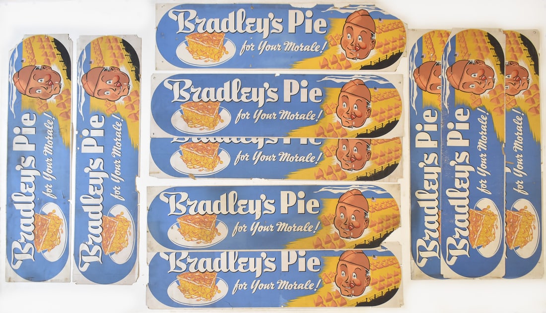 TEN "BRADLEY'S PIE" TROLLEY CAR ADVERTISING SIGNS, WWII ERA: Ten "Bradley's Pie for Your Morale!" trolley car advertising signs circa WWII era measuring 11" H x 42" W x 0.25" D.