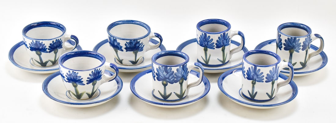 LOUISVILLE STONEWARE MUGS AND SAUCERS: Six saucers, two teacups and four coffee mugs all in the Louisville "Bachelor Button Blue". All pieces were manufactured in 1994. Saucers measure 6.5" H x 6.5" W x 1" D.