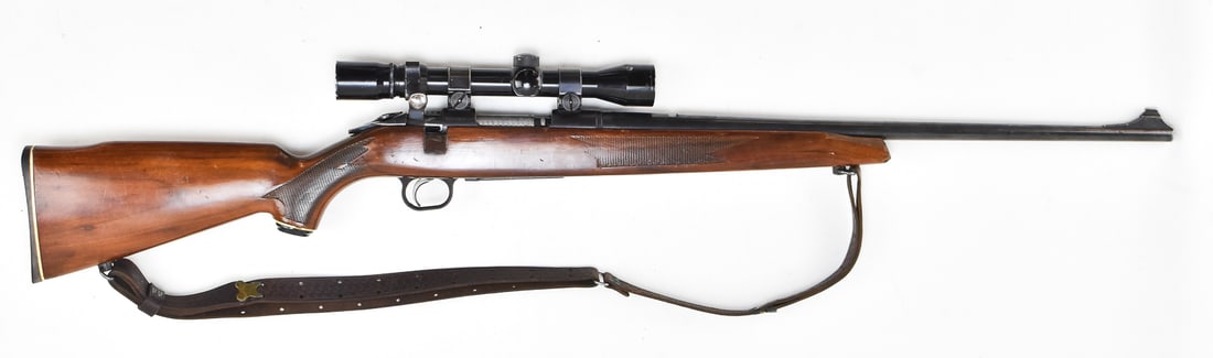 MOSSBERG MODEL 800B BOLT-ACTION IN .243 WIN W/ BUSHELL SCOPE: A Mossberg Model 800B bolt-action rifle chambered in .243 Winchester with a Bushnell Sportview 3x-9x scope. The rifle has a leather sling and lacquered wood stock. The rifle has a barrel length of