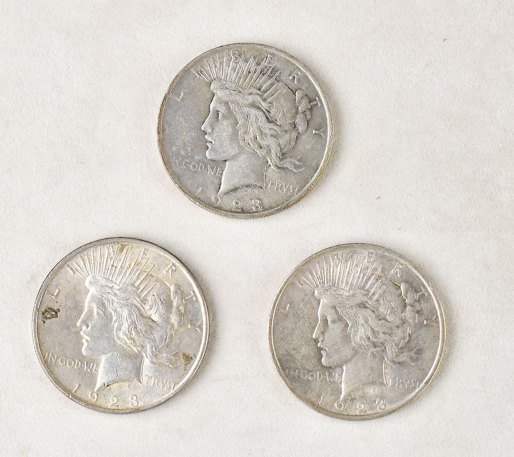 3 1923 PEACE DOLLARS: Three 1923 Peace Dollars minted in Philadelphia. Each coin is struck in 90% silver and has an approximate weight of 26.7 grams.