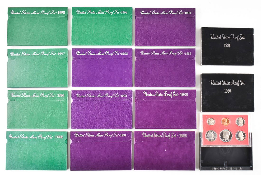14 U.S. PROOF SETS FROM 1980s & 1990s: Fourteen U.S. proof sets from 1980, 1981, 1985, 1986, 1989, and 1990-1998. Each set comes in a hard plastic case and paper case measuring 3.5" H x 5.5" W x 0.4" D.