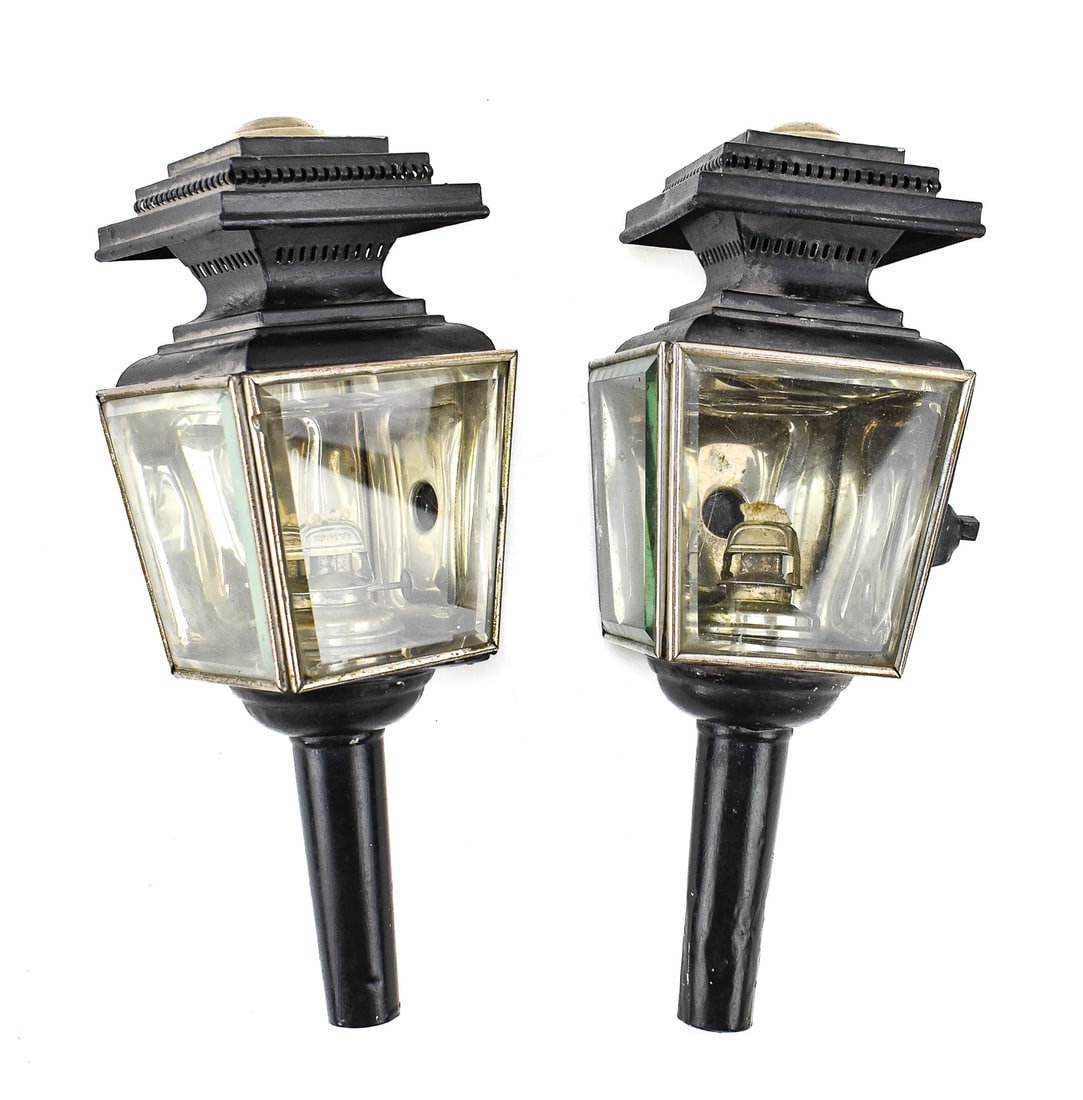 EDWARD MILLER COMPANY CARRIAGE LANTERN PAIR: An Edward Miller Company carriage lantern pair with beveled glass panel and red gem backs, circa early 20th century. The item resting measures 6.5" H, 5.5" W, 14.5" D.