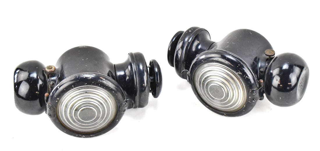 THE CORCORAN VICTOR COMPANY FORD MODEL T CARRIAGE LAMP PAIR: A pair of The Corcoran Victor Company Ford Model T kerosene carriage lamp, last patented 1917. The item resting measures 5" H, 6" W, 10" D.