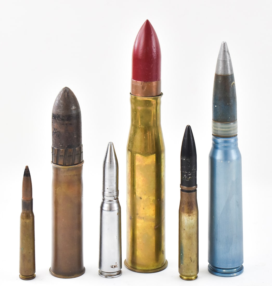 COLLECTION OF INERT MILITARY ROUNDS: A collection of six inert military rounds including a 37mm M16 round dated 1943, a 30mm armor-piercing round dated 1976/1977, a 37mm MKIII from 1941, a 20mm MK4 from 1944, a 20mm training round, and a