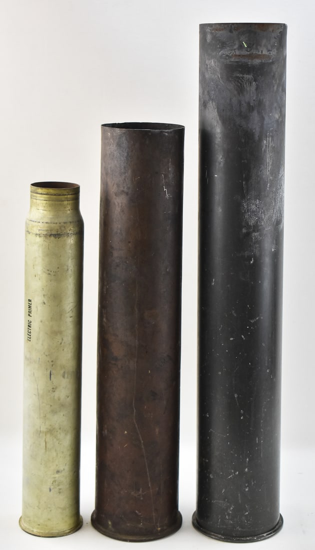 THREE LARGE US NAVY SHELLS: An assortment of three large military shellsused by the US Navy including a MK 67 MOD 3, a 5-inch MK5 dated 1945, and a 3-inch Mark 9 50 Cal. dated 1957. The largest shell measures 33" H x 5.5" W x 5.