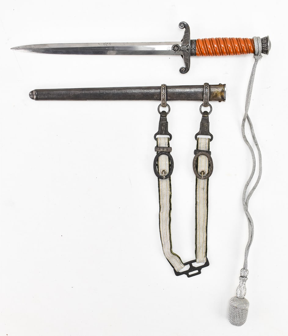 MAX WEYERSBERG WAFFENFABRIK GERMAN WWII ARMY HEER DAGGER: A Max Weyersberg Waffenfabrik (WMW) German World War II Army heer dagger (blade length: 10") with scabbard. The dagger has a celluloid grip, dagger hangers with silver bullion uppers and olive green