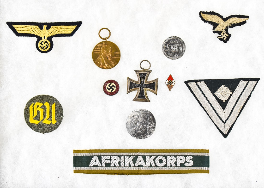 GERMAN WORLD WAR I-II ASSORTMENT: BADGES, PATCHES, & MEDALS: This lot includes a German World War I second class pattee Iron Cross with a Royal Cypher "W" and Imperial crown on the obverse and "FW" on the reverse, 1897 bronze jubilee 'Centennial Medal'