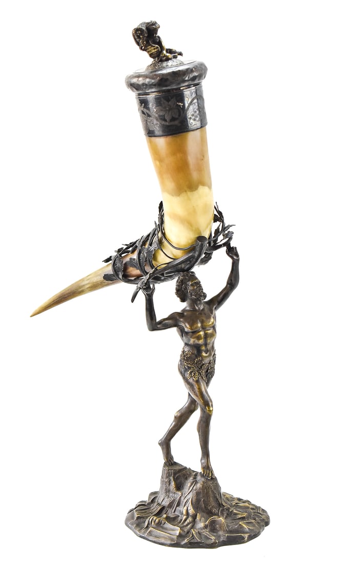 ADOLF BRAESE "THE STATUE OF THE DANCING FAUN" PRESENTATION DRINKING HORN, LATE 19TH CENTURY: A figural drinking horn depicting a satyr based on the House of the Faun's "The Statue of the Dancing Faun" made circa 1890s by Swedish silversmith Adolf Braese. Adolf Braese was an active