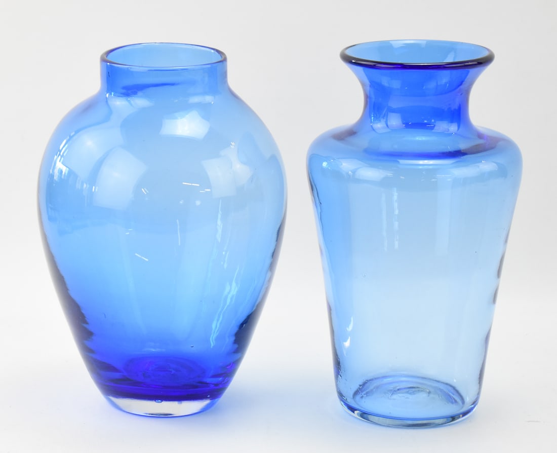 PAIR OF POSTMODERN BLENKO AZURE BLUE ART GLASS VASES: A pair of Postmodern Blenko hand-blown azure blue art glass vases, circa 1990s. The slightly larger vase measures 10" H X 6" W x 6" D.
