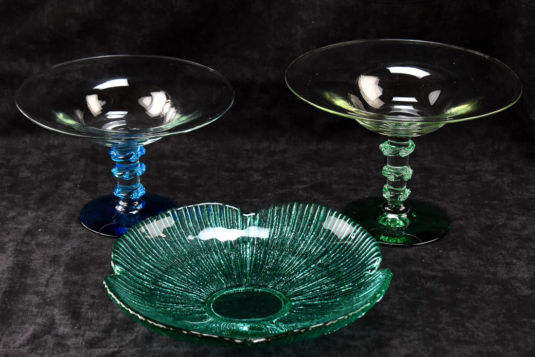 MID-CENTURY BLENKO ART GLASS PEDESTAL COMPOTES & A PETAL CENTERPIECE BOWL: A collection of Mid-century Blenko Glass which includes: two compotes, one in sea green and one in blue; also includes a sea green petal shaped centerpiece bowl No. 625M measuring 3" H x 13" W x 13" D