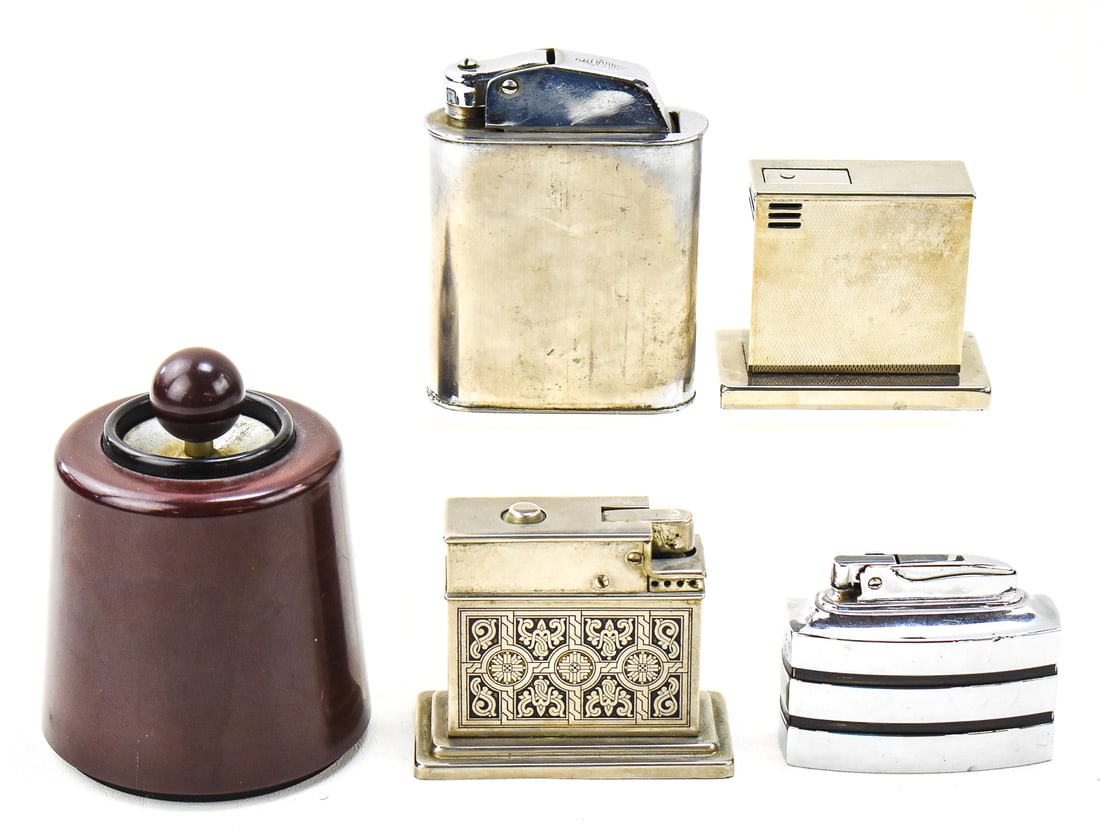 20TH CENTURY TABLE LIGHTER ASSORTMENT: DORSET, RONSON, MYLFLAM, & MORE: This lot includes the following table lighters, circa early - mid 20th century: Dorset Light Industries flintless battery-operated Bakelite lighter, Brevete SGDG "Floating", Mylflam, Augusta, and Rons