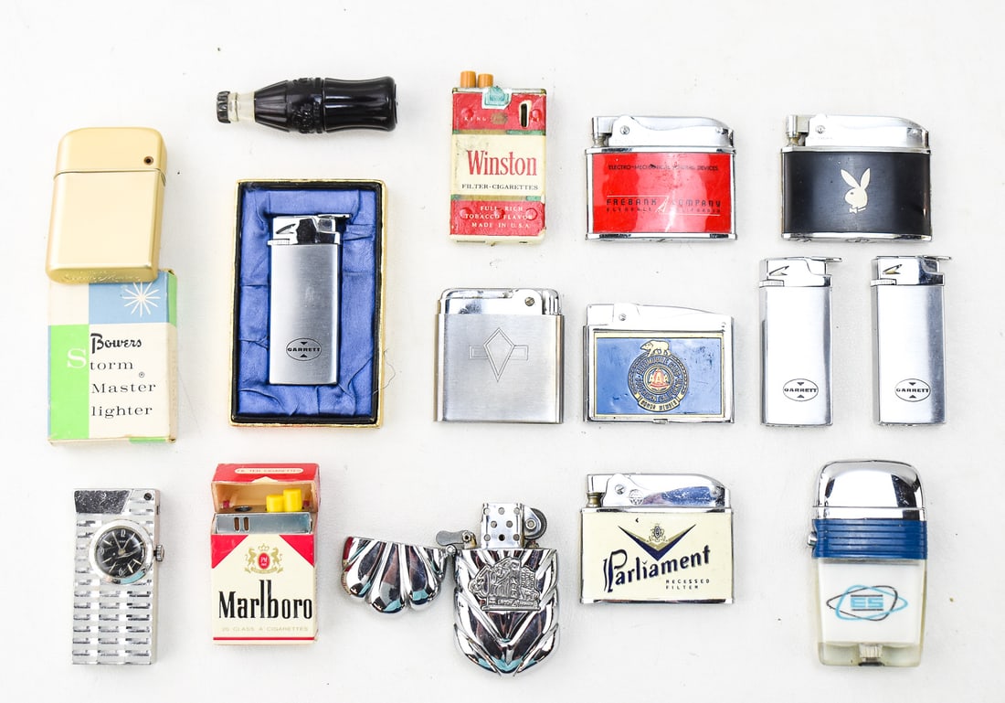 ADVERTISEMENT LIGHTER ASSORTMENT: PLAYBOY, WINSTON, MARLBORO, & MORE: This lot includes the following advertisement lighters and more: Playboy, Philip Morris Marlboro cigarette pack-form lighter, Crown Winston cigarette pack-form lighter, Swank clock lighter No. 4961, J