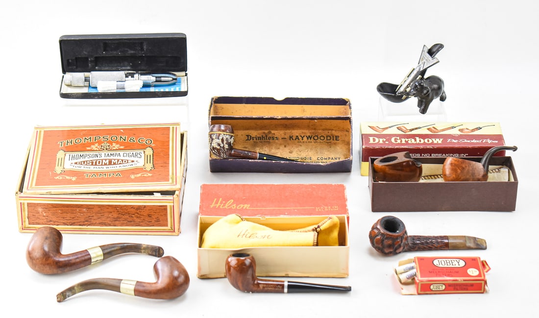 TOBACCO PIPES & PIPE ACCESSORIES: SHAMROCK, WILLARD, COLONEL FRASER, MILANO, DR. GRABOW: An assortment of seven tobacco pipes from Shamrock of Ireland, Willard, Colonel Fraser, Milano, and Dr. Grabow vest-pocket pipes. This lot also includes a Sir Walter Raleigh pipe cleaner, Kleen Reem p