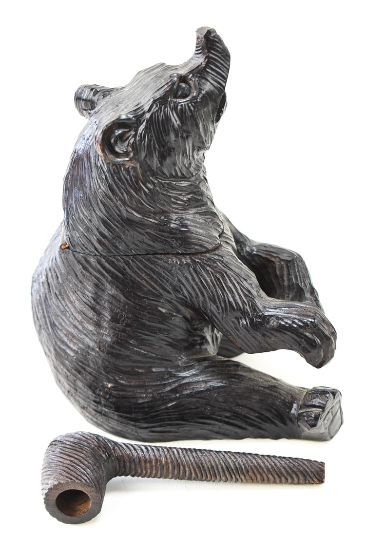 CUSTOM CARVED BEAR HUMIDOR: Hand-carved in a small village in China circa 1990s. The wood type is similar to Okoume or cedar. Comes with a matching pipe. The humidor has measurements of 8.5" H x 5.5" W x 6" D.