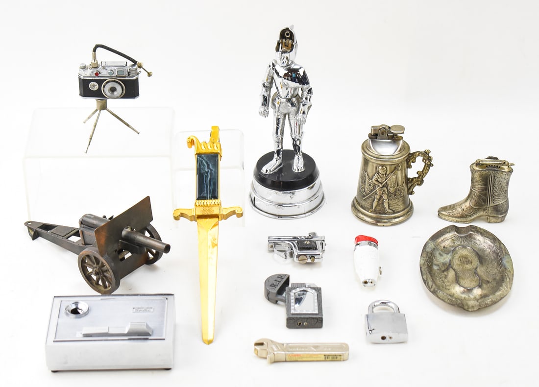 ASSORTMENT OF NOVELTY LIGHTERS & OCCUPIED JAPAN ASHTRAY: An assortment of twelve novelty lighters and a cowboy style ashtray marked Made in Occupied Japan. Some of the notable lighters include a novelty knight lighter with a working wind-up music box base, 