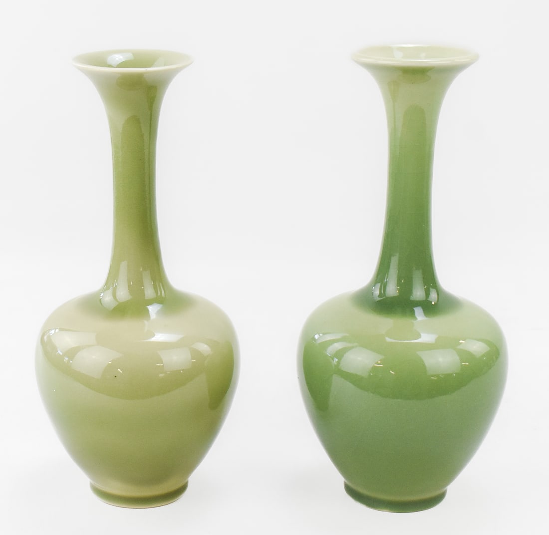 ROOKWOOD VASES No. 778 LONG NECK VASE PAIR: This lot includes a pair of 1947 Rookwood long neck green vases No. 778, one of the vases is in the crackle glaze. The item measures 10" H, 4" W, 4" D.