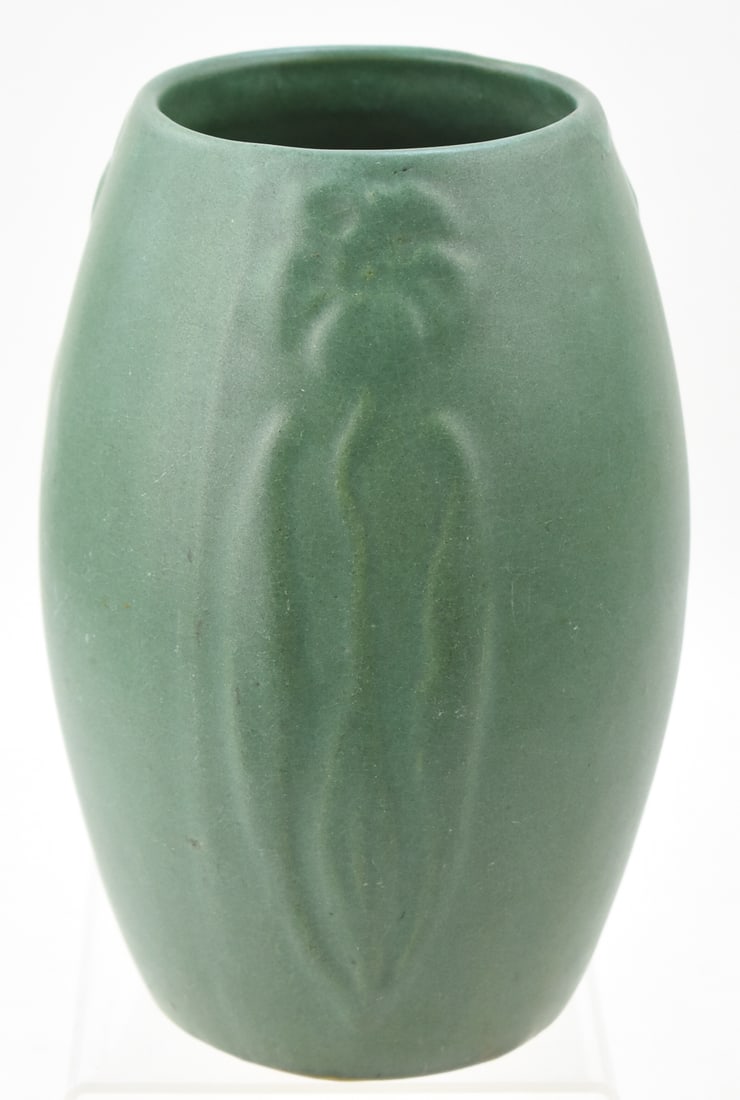 ZANESVILLE STONEWARE RAISED FLOWER PATTERN VASE: A Zanesville stoneware vase with a raised flower pattern marked "101", circa early 20th century. The item measures 9" H, 5" W, 5" D.