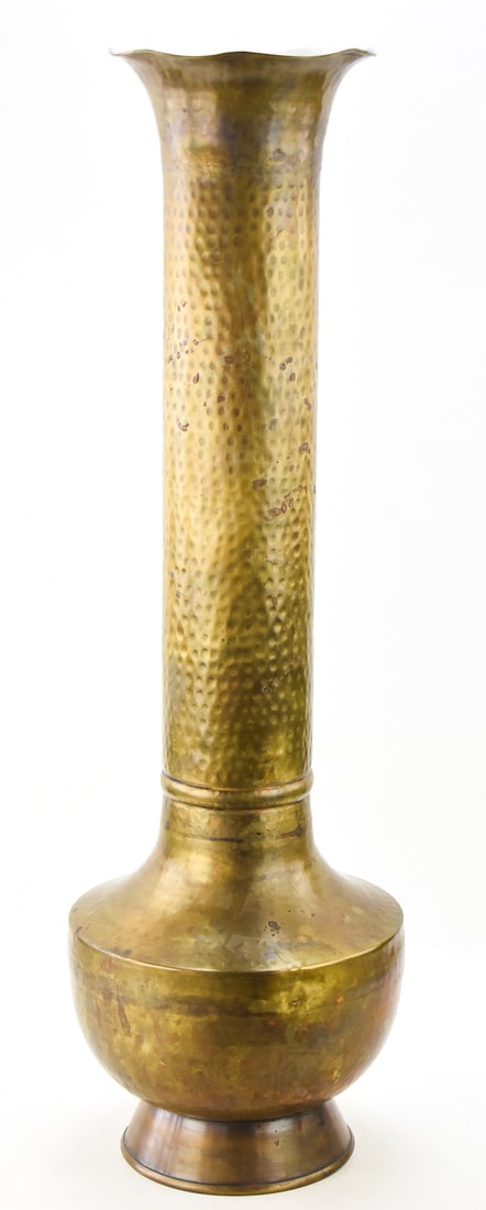 ARTS AND CRAFTS LARGE HAMMERED BRASS VASE IN THE STYLE OF ROYCROFT 'AMERICAN BEAUTY': An Arts and Crafts large hammered brass vase in the style of "American Beauty" by Roycroft, measuring 36" H x 11" W x 11" D.