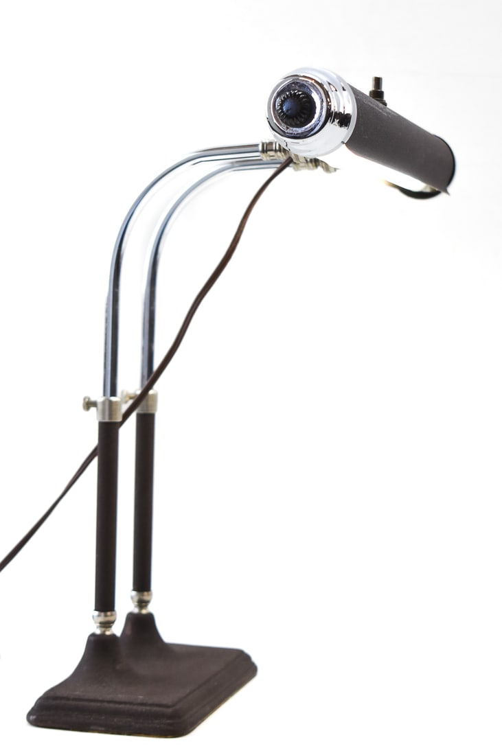 MID-CENTURY INDUSTRIAL GOOSENECK DESK LAMP: A Mid-century industrial gooseneck desk lamp with a heavy patina finish measuring 14.5" H x 15" W x 7" D.