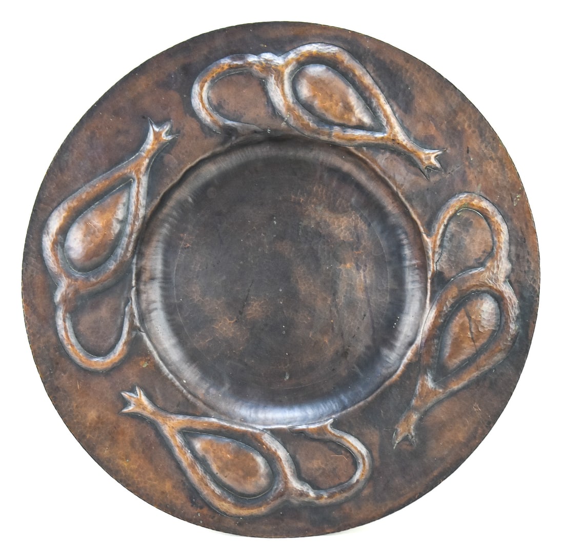 'SEED POD' HAMMERED COPPER CHARGER, ROBERT J. TROUT, ROYCROFT RENAISSANCE: A "Seed Pod" pattern hammered copper charger made by Roycroft Renaissance Master Artisan Robert "Bob" J. Trout (1943-2020). The item is marked on the base with the double-R Roycroft Renaissance mark, 