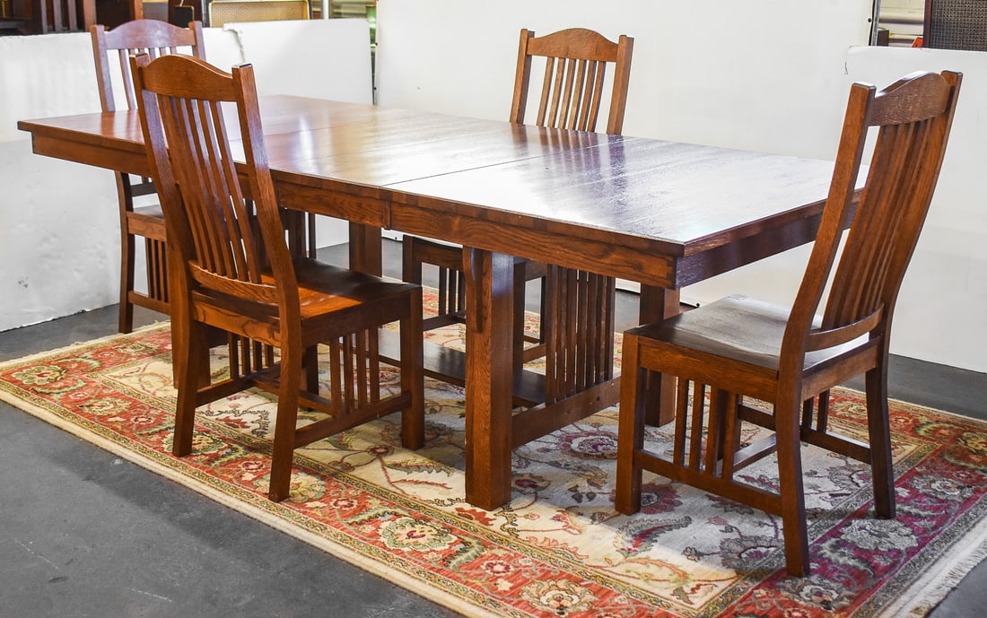 EUROPEAN WOOD CLASSICS ARTS AND CRAFTS STYLE KITCHEN TABLE AND CHAIRS: A European Wood Classics Arts and Crafts style kitchen table with two leaves and four chairs. The table measures 30.5" H, 96" W (16" W leaves), 42" D and the chairs measure 42" H, 18.5" W, 21" D.