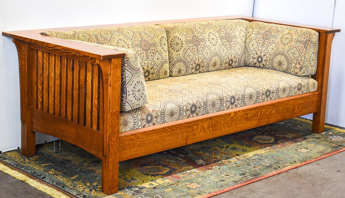 ARTS AND CRAFTS MISSION OAK STYLE AMISH SETTLE SOFA: A contemporary Arts and Crafts Mission oak style Amish made settle sofa measuring 29.5" H x 84" W x 36" D.