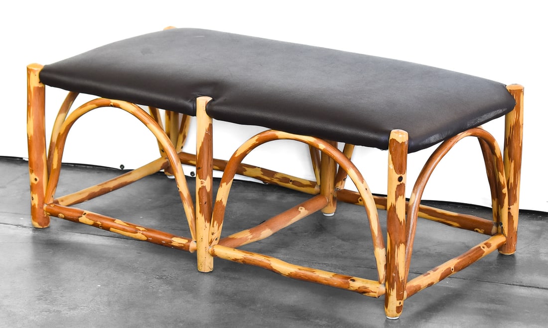 OLD HICKORY DOUBLE BENCH: An Old Hickory double bench upholstered in black leather; made in Shelbyville, IN. The item measures 17" H x 41" W x 21" D.