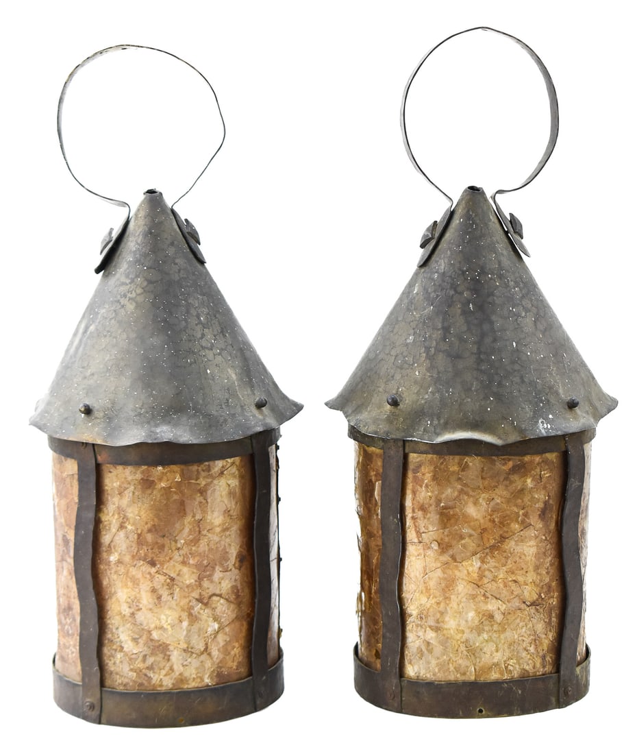 ARTS AND CRAFTS MICA LANTERN PAIR: A pair of Arts and Crafts mica exterior house lanterns, circa early 20th century. The item measures 19" H, 8" W, 8" D.