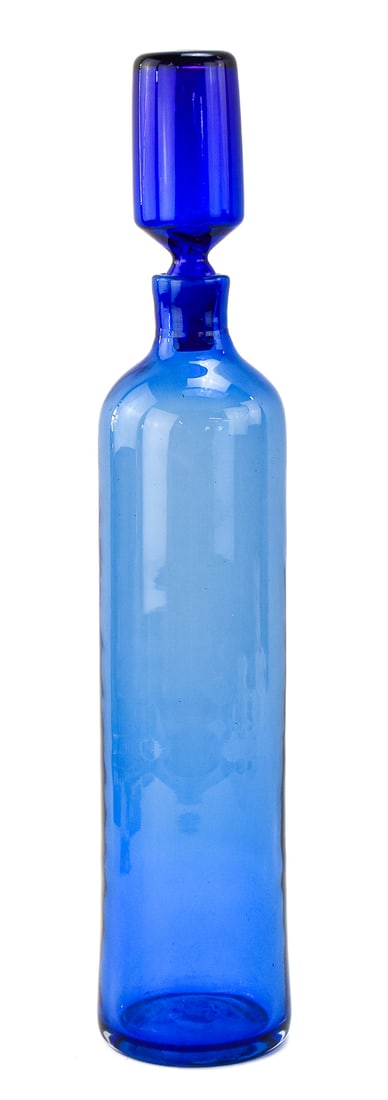 MID-CENTURY WAYNE HUSTED FOR BLENKO GLASS PERSIAN BLUE DECANTER: A Mid-century Blenko Glass Persian blue decanter No. 5914 designed by Wayne Husted, circa 1959. The decanter measures 21.5" H x 4" W x 4" D.