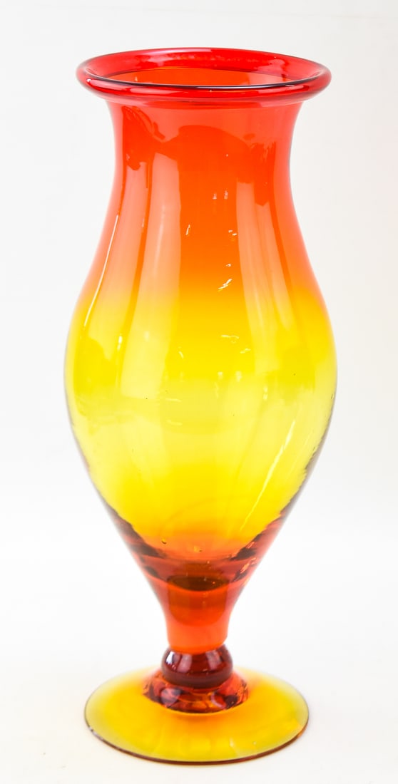 MID-CENTURY BLENKO GLASS AMBERINA PEDESTAL VASE: A Mid-century Blenko Glass amberina pedestal vase measuring 17" H x 6.5" W x 6.5" D.