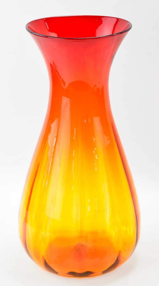 MID-CENTURY BLENKO GLASS AMBERINA VASE: A Mid-century Joel Myers for Blenko Glass amberina ribbed vase measuring 16.5" H x 8" W x 8" D.