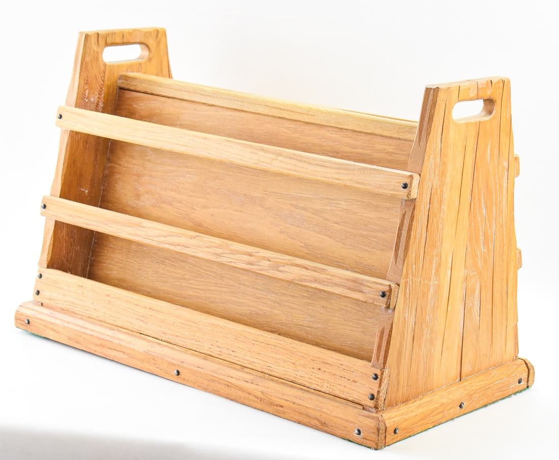 BRANDT RANCH OAK DOUBLE-SIDED MAGAZINE RACK: A Brandt Ranch oak double-sided magazine rack measuring 17" H x 25" W x 14" D.