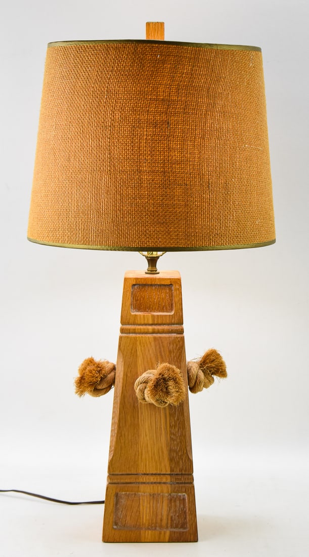 BRANDT RANCH OAK LAMP: A Brandt Ranch Oak lamp with woven burlap drum shade. The lamp with the shade measures 28" H x 14" W x 14" D.