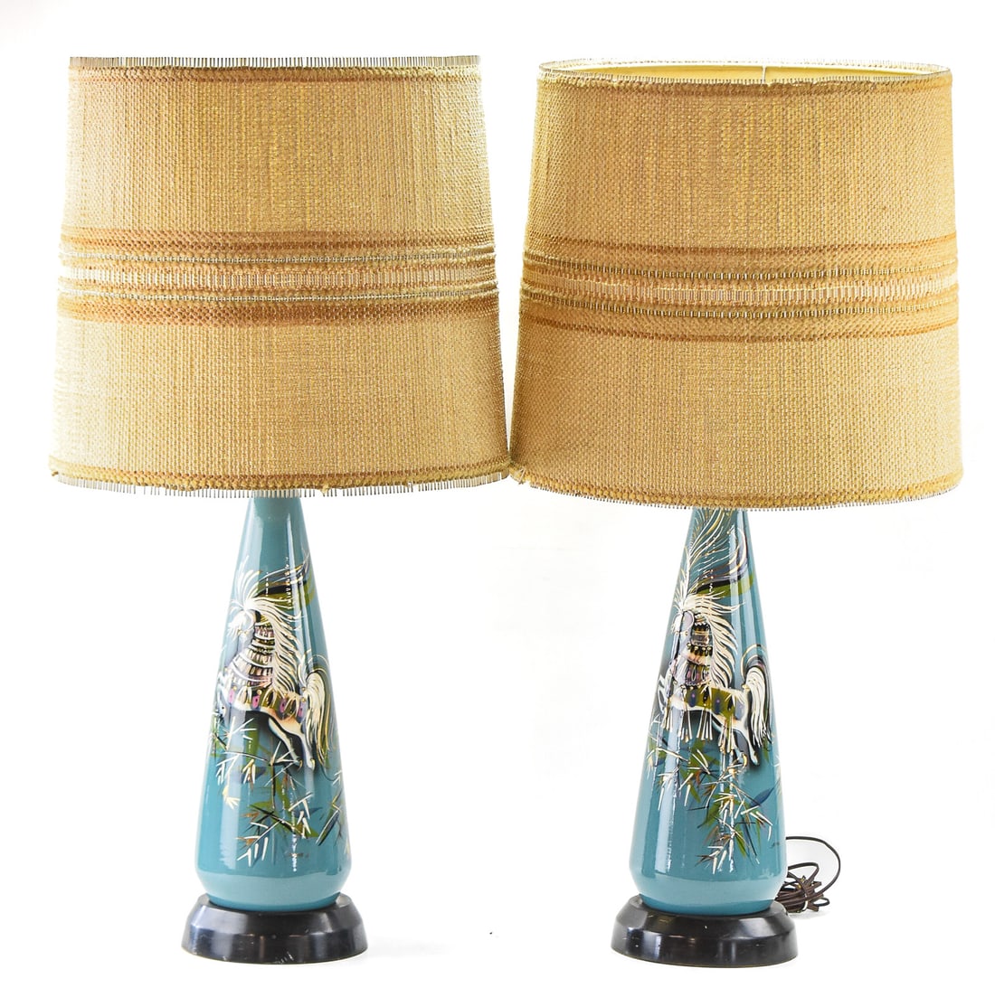 PAIR OF CERAMIC LAMPS BY SASCHA BRASTOFF CALIFORNIA: A pair of tall painted ceramic lamps made by Sascha Brastoff California. Each lamp features Brastoff's signature horse designs on a teal background, and each piece is signed by the artist. The lamps