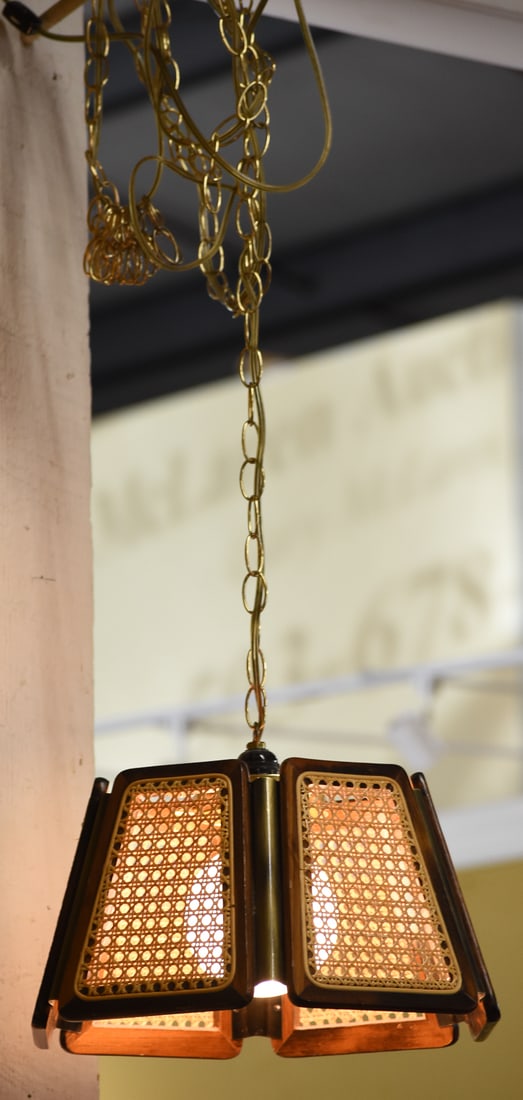 HANGING CANE WOVEN PENDANT LIGHT FIXTURE: A cane woven hanging pendant light fixture, circa 1960-1970s. The item measures 8.5" H, 16" W, 16" D.