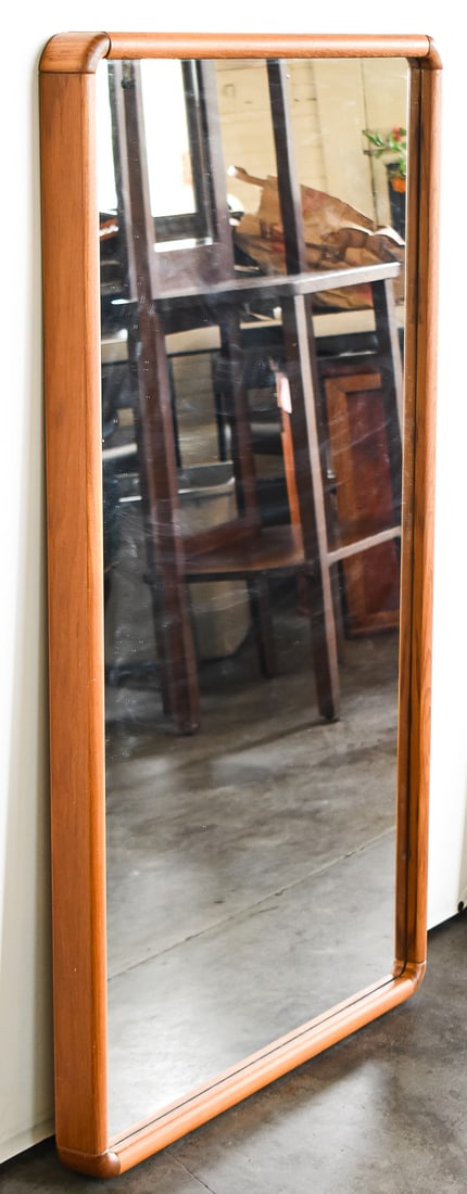 MID-CENTURY MODERN WOODEN-FRAMED WALL MIRROR: A Mid-century Modern style wooden-framed wall mirror made by the Sun Cabinet Company of Thailand measuring 45.5" H x 27.5" W x 2.5" D.