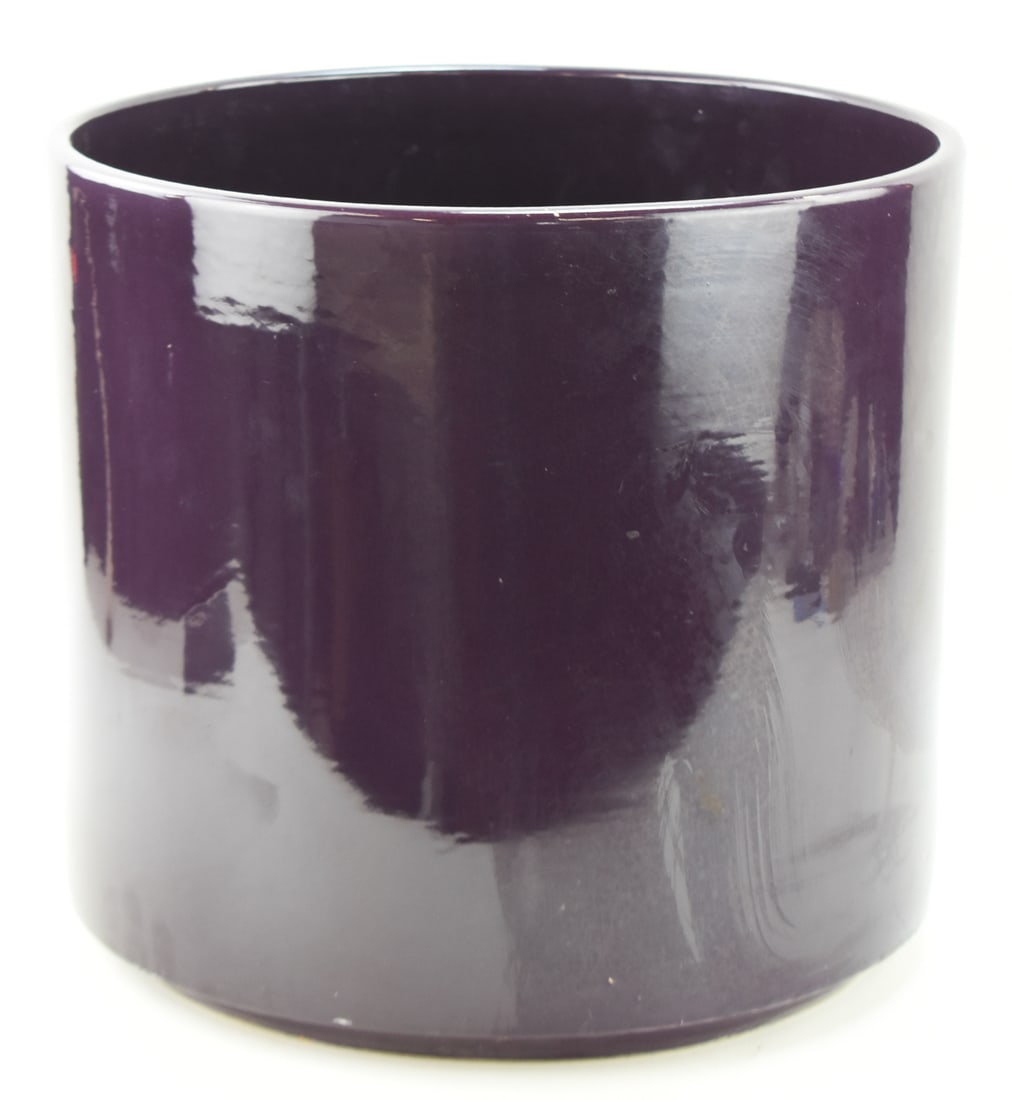 GAINEY CERAMICS AC14 PURPLE PLANTER: A Gainey Ceramics of California AC14 planter in glazed purple measuring 14" H x 15" W x 15" D.