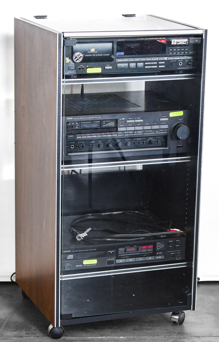 STEREO CABINET W/ SONY CDP-C910, YAMAHA R-8 AM/FM RECEIVER, & DENON DCD-1100: A wooden stereo cabinet with a glass front door and glass top made in Italy with the following stereo equipment inside: A Sony CDP-910 10-disc Hi-Fi "magazine-type" player/changer produced in the earl