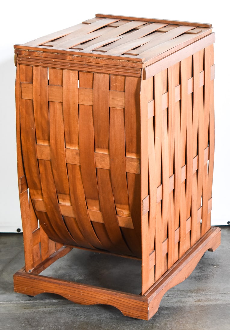 ANTIQUE WOVEN LAUNDRY HAMPER: An antique woven laundry hamper measuring 29" H x 22" W x 16.5" D.