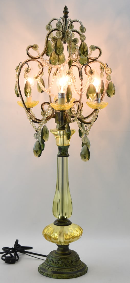 HOLLYWOOD REGENCY LUCITE CHANDELIER TABLE LAMP: A Hollywood Regency electric lucite chandelier table lamp, circa early - mid 20th century. The item measures 33.5" H, 10.5" W, 12" D.