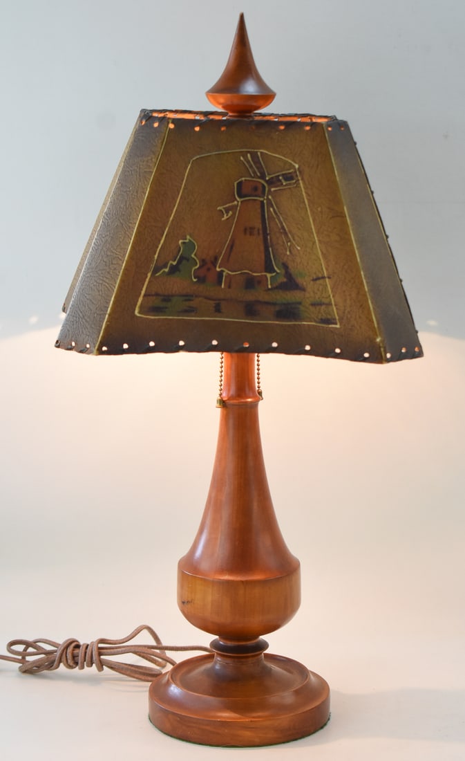 MID-CENTURY NORWEGIAN TEAK ACCENT LAMP: A Mid-century Norwegian teak accent lamp with a painted fiberglass shade with a windmill motif. The item measures 26.5" H x 12" W x 9" D.