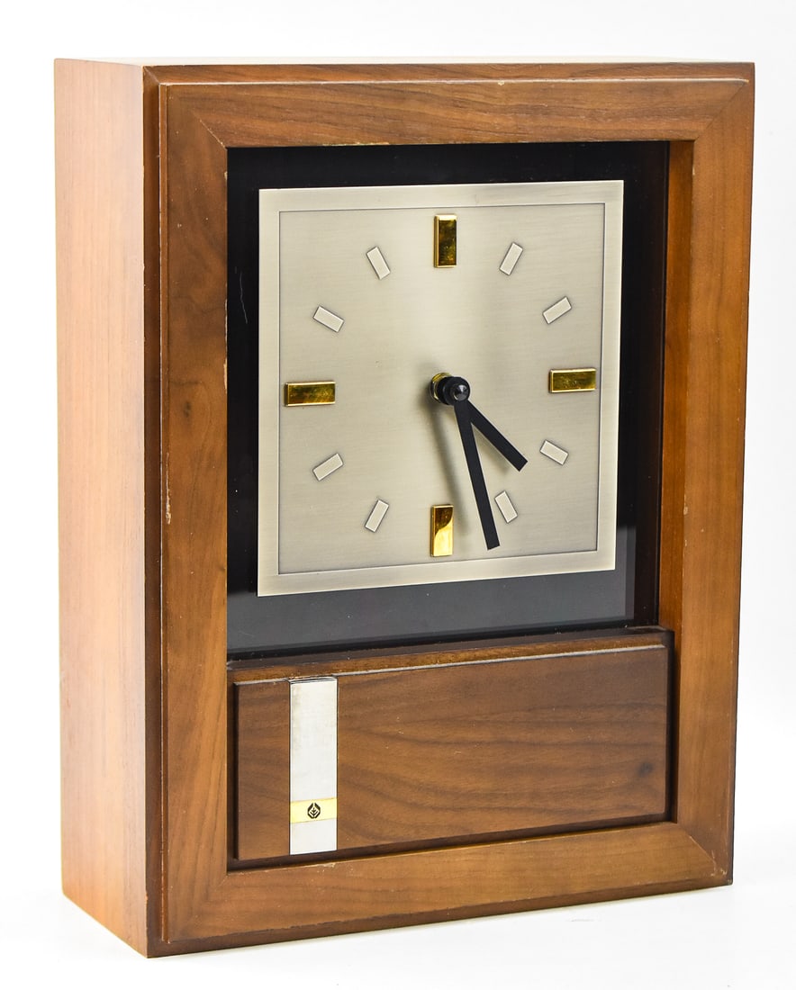 JOSTENS MID-CENTURY RECOGNITION CLOCK: A Jostens mid-century recognition wall or mantle clock. The clock measures 13" H x 10" W x 4.5" D