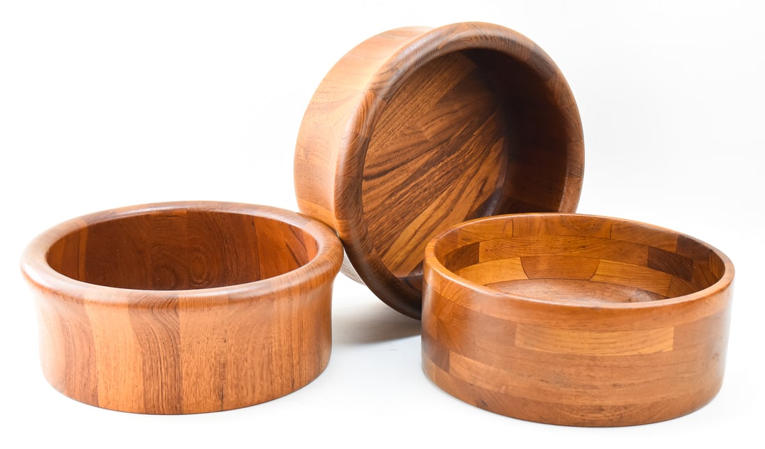 THREE LARGE TEAK BOWLS, KALMAR DESIGNS, DENMARK: Three large MCM teak wood bowls made by Kalmar Designs of Denmark. Each bowl has a burned in makers mark on the base. The largest bowl measure 5" H x 13" W x 13" D.
