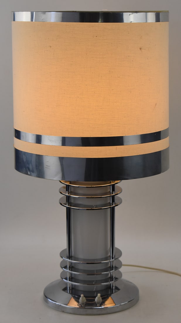 ITALIAN MID-CENTURY MODERN SPACE AGE CHROME & GLASS TABLE LAMP: An Italian Mid-century Modern Space Age style chrome and glass table lamp, circa 1970s. The center design of the lamp features segments of chrome rings with a white glass core, often attributed as Mur
