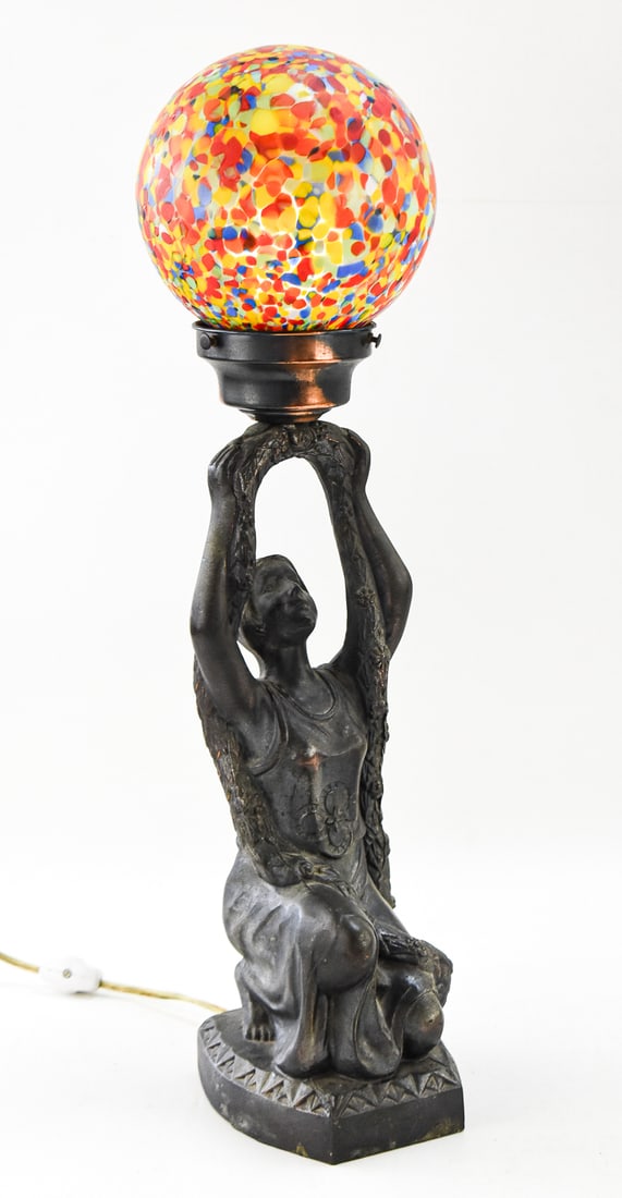 ART DECO JOAN OF ARC TABLE LAMP/'END OF DAY' LAMP SHADE: An Art Deco cast metal figural table lamp of Joan of Arc with a Czechoslovakian marked 'End of Day' pattern lamp shade, circa early 20th century. The item without the glass shade measures 17" H, 4.5"