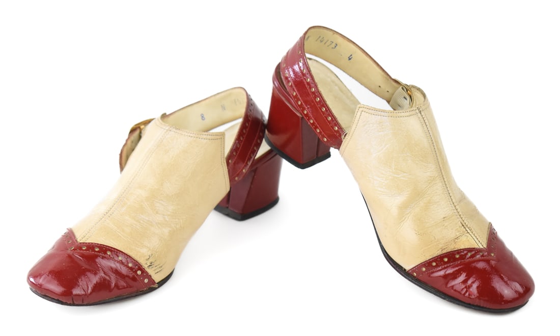 PENALJO LEATHER SLINGBACK HEELS: A pair of Penaljo leather slingback heels in size 8, circa mid 20th century. The item measures 4" H, 3.5" W, 9.5" D.