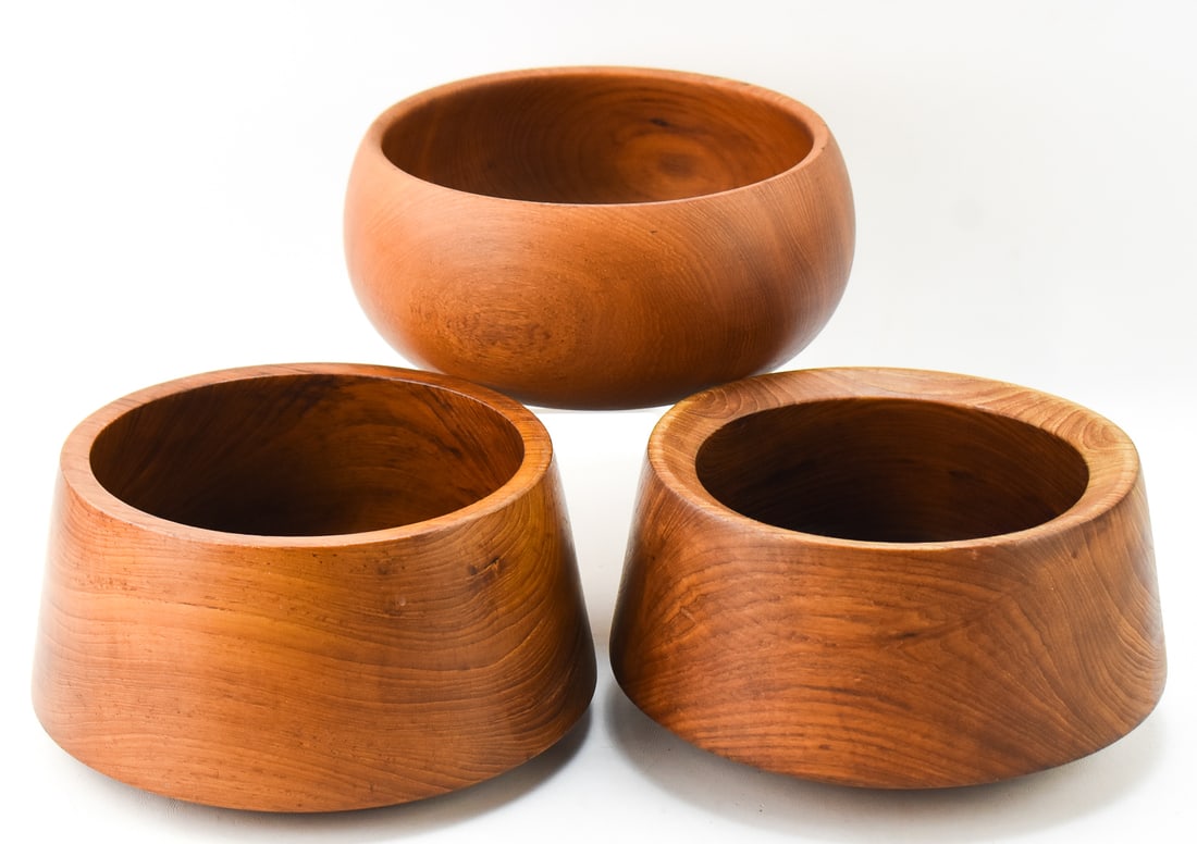TRIO OF TEAK SERVING BOWLS: A trio of teak serving bowls with no makers marks, circa mid-late 20th century. The largest measures 5.5" H x 10" W x 10" D.
