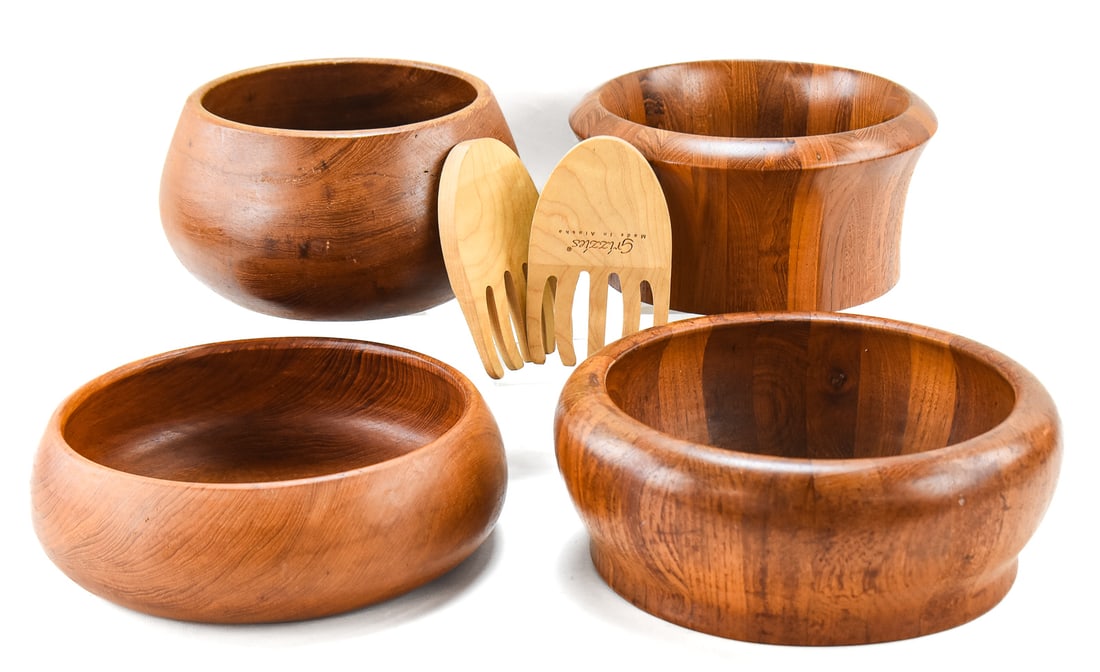 MID-CENTURY TEAK BOWLS & SERVING UTENSILS: An assortment of four large mid-century teak bowls and a pair of Grizzies wood salad hands made in Alaska. Two of the teak bowls are marked "Scanlook. Designed by AQ" and the others are marked as