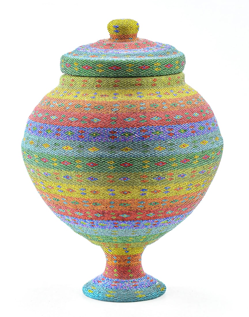 INDONESIAN BEADED RATTAN BASKET: An Indonesian beaded lidded rattan basket, likely from Bali. The item measures 16" H, 10.5" W, 10.5" D.